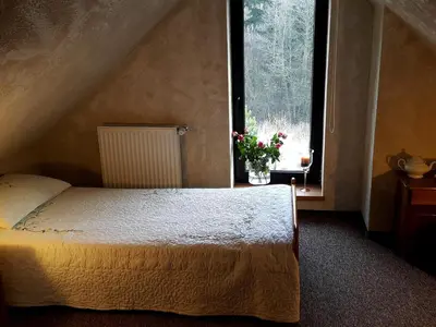 Łóżko lub łóżka w pokoju w obiekcie Zajazd Byczy Róg