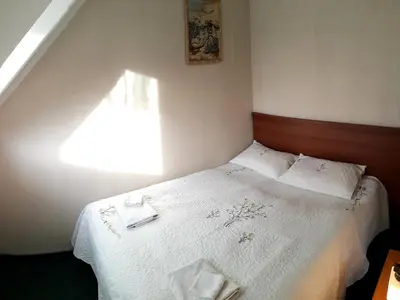 Łóżko lub łóżka w pokoju w obiekcie Zajazd Byczy Róg