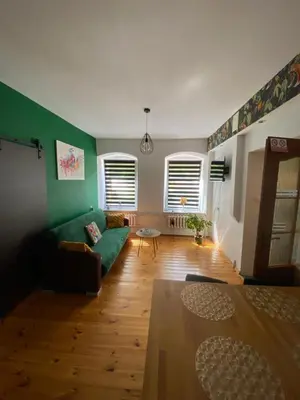 Łóżko lub łóżka w pokoju w obiekcie Pod Papugami