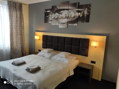 Łóżko lub łóżka w pokoju w obiekcie DWOREK PESZKÓW