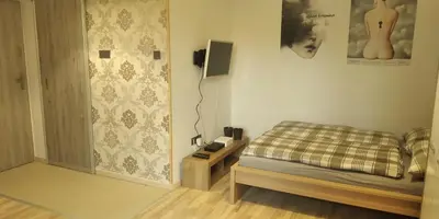 Łóżko lub łóżka w pokoju w obiekcie Apartament Kosciuszki