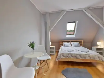 Łóżko lub łóżka w pokoju w obiekcie Apartament w Mieście