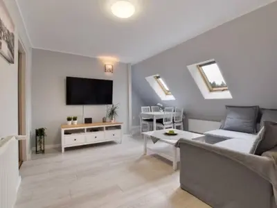 Telewizja i/lub zestaw kina domowego w obiekcie Apartament w Mieście