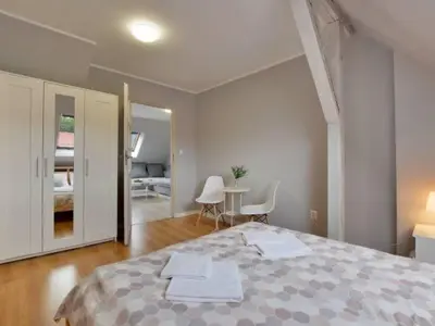 Łóżko lub łóżka w pokoju w obiekcie Apartament w Mieście