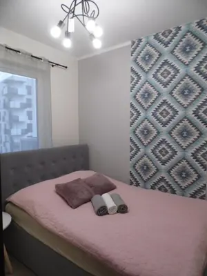 Łóżko lub łóżka w pokoju w obiekcie Apartament nad Odrą II