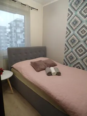 Łóżko lub łóżka w pokoju w obiekcie Apartament nad Odrą II