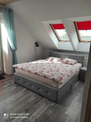 Łóżko lub łóżka w pokoju w obiekcie Willa Relaks