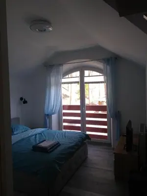 Łóżko lub łóżka w pokoju w obiekcie Willa Relaks