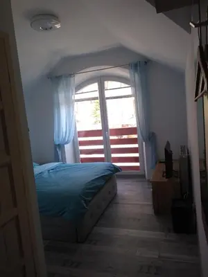 Łóżko lub łóżka w pokoju w obiekcie Willa Relaks