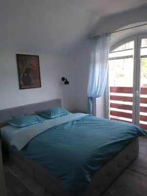 Łóżko lub łóżka w pokoju w obiekcie Willa Relaks