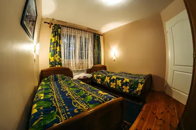 Łóżko lub łóżka w pokoju w obiekcie Ośrodek Szkoleniowo-Wypoczynkowy 