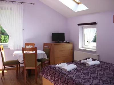 Łóżko lub łóżka w pokoju w obiekcie Zajazd Idylla