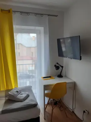 Telewizja i/lub zestaw kina domowego w obiekcie SZWEDZKA22 PL Premium Rooms
