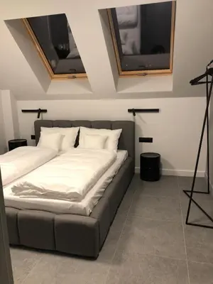 Łóżko lub łóżka w pokoju w obiekcie Apartamenty Caminski Deluxe