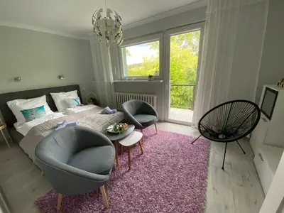 Łóżko lub łóżka w pokoju w obiekcie Blue Sky Apartament