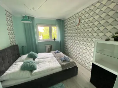 Łóżko lub łóżka w pokoju w obiekcie Blue Sky Apartament