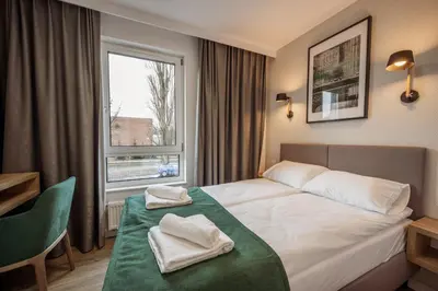 Łóżko lub łóżka w pokoju w obiekcie Marina Apartments ZOO