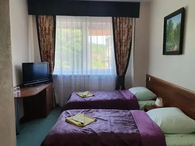 Łóżko lub łóżka w pokoju w obiekcie Hotel Sudety