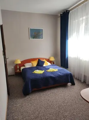 Łóżko lub łóżka w pokoju w obiekcie Hotel Sudety