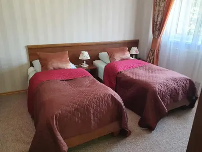 Łóżko lub łóżka w pokoju w obiekcie Hotel Sudety