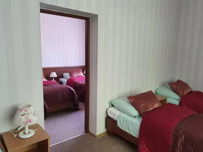 Łóżko lub łóżka w pokoju w obiekcie Hotel Sudety
