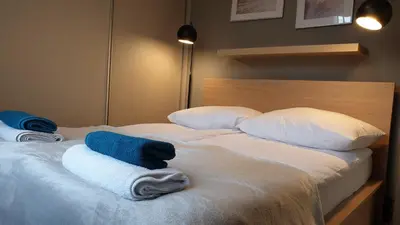 Łóżko lub łóżka w pokoju w obiekcie LAGUNA 21 Apartament z Cyganką