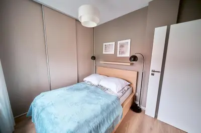Łóżko lub łóżka w pokoju w obiekcie LAGUNA 21 Apartament z Cyganką