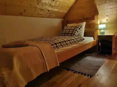 Łóżko lub łóżka w pokoju w obiekcie Apartament Zielone Okiennice