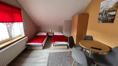Łóżko lub łóżka w pokoju w obiekcie Willa Justynka