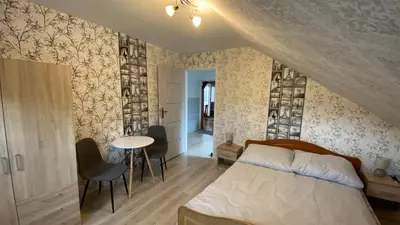 Łóżko lub łóżka w pokoju w obiekcie Willa Justynka