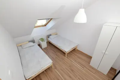 Łóżko lub łóżka w pokoju w obiekcie Apartament Słoneczny 4