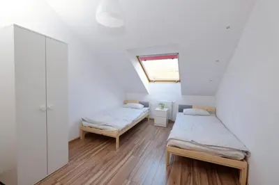 Łóżko lub łóżka w pokoju w obiekcie Apartament Słoneczny 4