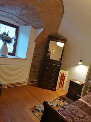 Łóżko lub łóżka w pokoju w obiekcie Gościniec Śliwkowy Sad