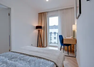 Łóżko lub łóżka w pokoju w obiekcie Apartament Kępa Mieszczańska - Old Town- free Parking - 15 min do Rynku