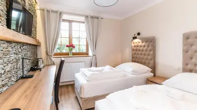Łóżko lub łóżka w pokoju w obiekcie Apartamenty Kapitańskie