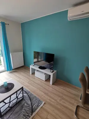 Telewizja i/lub zestaw kina domowego w obiekcie Apartament NaGrobli