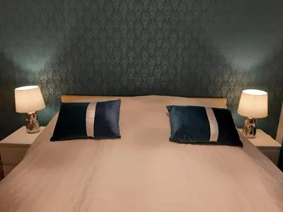 Łóżko lub łóżka w pokoju w obiekcie Apartament NaGrobli