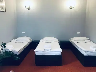 Łóżko lub łóżka w pokoju w obiekcie Legnicki Browar Książęcy Hotel i Restauracja