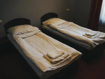 Łóżko lub łóżka w pokoju w obiekcie Legnicki Browar Książęcy Hotel i Restauracja