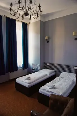Łóżko lub łóżka w pokoju w obiekcie Legnicki Browar Książęcy Hotel i Restauracja