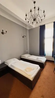 Łóżko lub łóżka w pokoju w obiekcie Legnicki Browar Książęcy Hotel i Restauracja