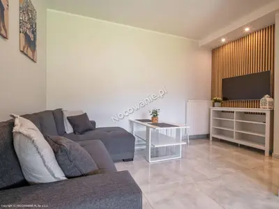 Telewizja i/lub zestaw kina domowego w obiekcie Apartamenty Cichy Zakątek