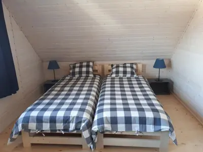 Łóżko lub łóżka w pokoju w obiekcie SuliLand Domki pod Ślężą