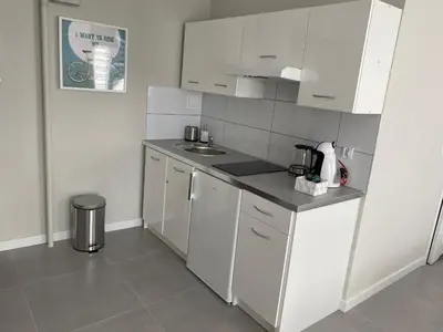 Kuchnia lub aneks kuchenny w obiekcie APARTAMENT OŚ. BŁĘKITNE 10H