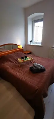 Łóżko lub łóżka w pokoju w obiekcie Kamienica Radków
