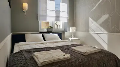 Łóżko lub łóżka w pokoju w obiekcie Apartament w samym sercu Opola 2