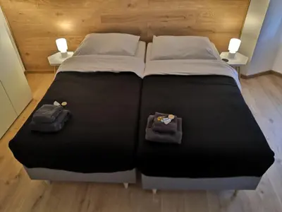 Łóżko lub łóżka w pokoju w obiekcie OficynaApartments