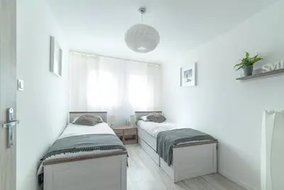 Łóżko lub łóżka w pokoju w obiekcie LeSi