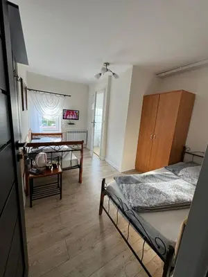 Łóżko lub łóżka w pokoju w obiekcie Pokoje Gościnne u Reni