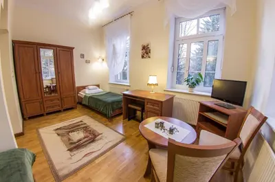Łóżko lub łóżka w pokoju w obiekcie Szwajcarka Willa z sauną i jacuzzi